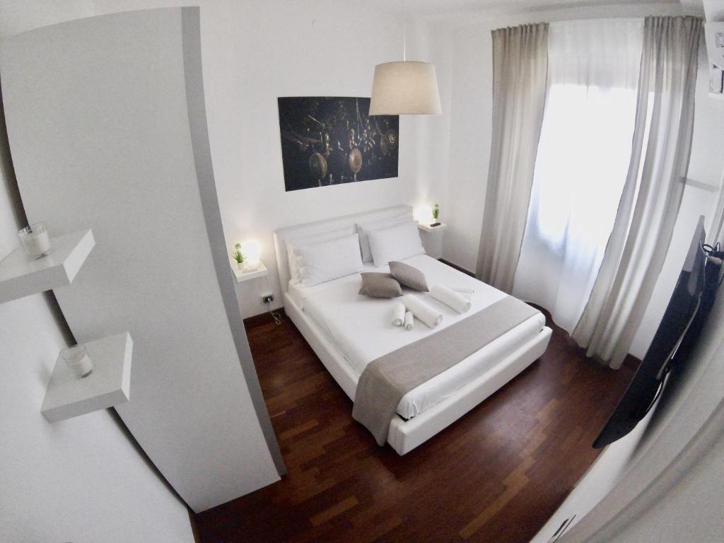 Uma cama ou camas num quarto em Mythos Affittacamere