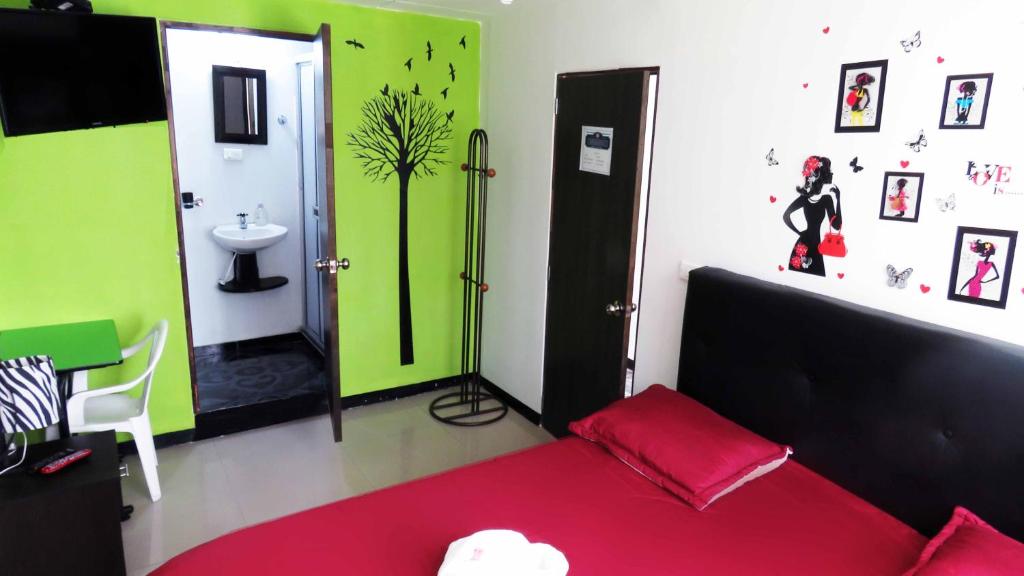 Postel nebo postele na pokoji v ubytování Hotel Bogota House