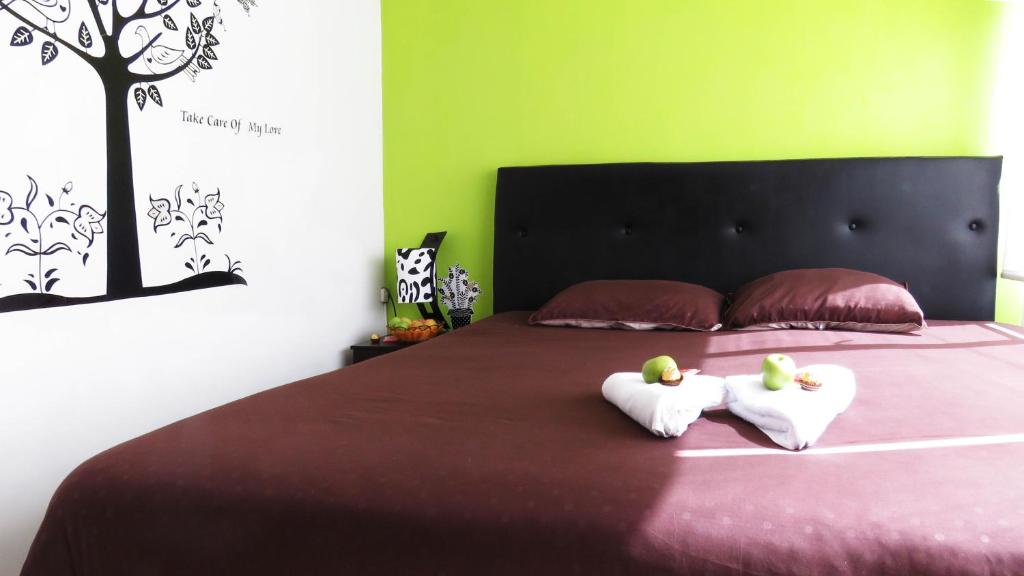 Postel nebo postele na pokoji v ubytování Hotel Bogota House