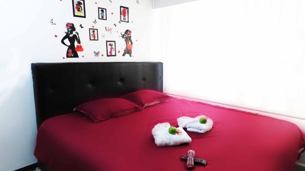 Postel nebo postele na pokoji v ubytování Hotel Bogota House