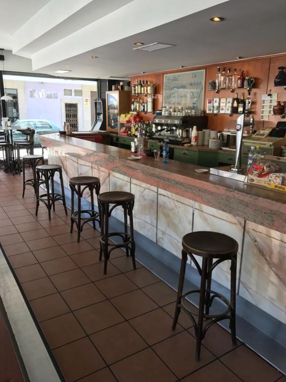 The lounge or bar area at Albergue O Pedrón Hostel & Rooms