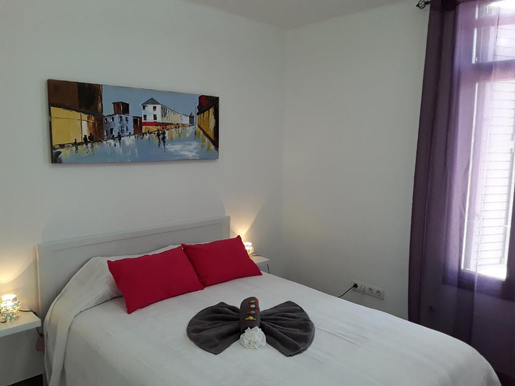 A bed or beds in a room at Central Seaview Apartment Puerto del Carmen