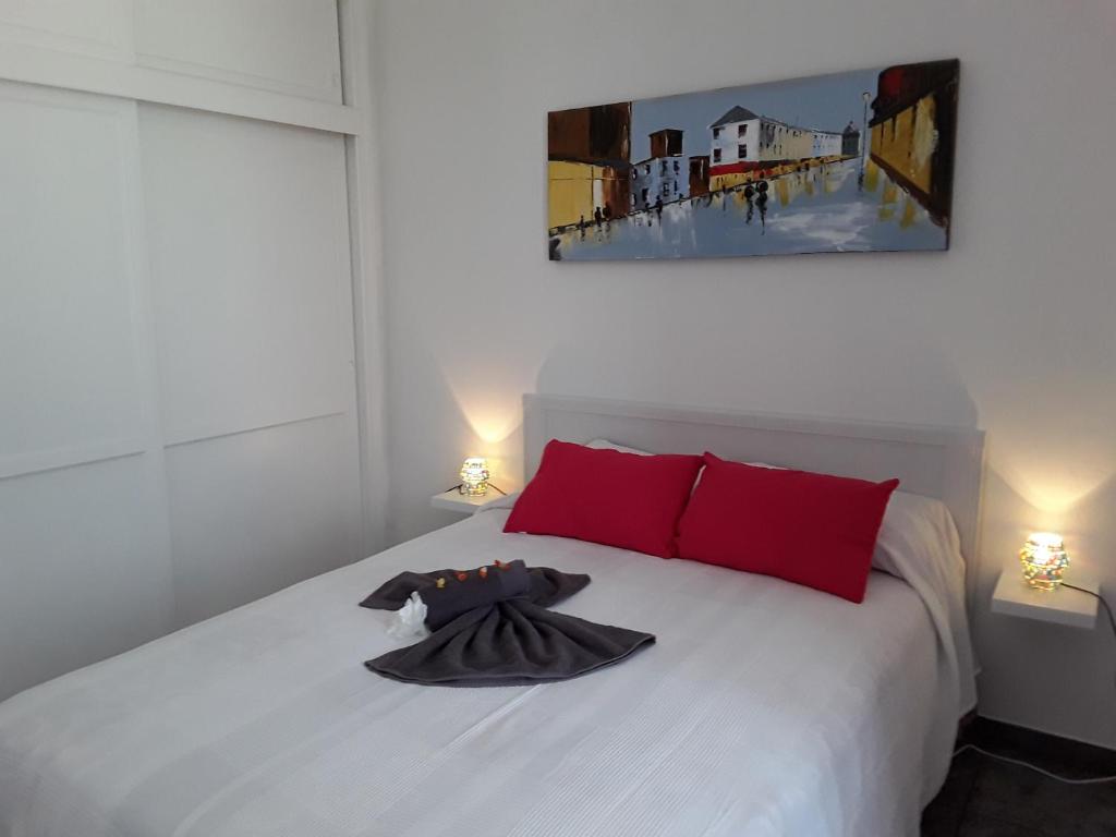 A bed or beds in a room at Central Seaview Apartment Puerto del Carmen