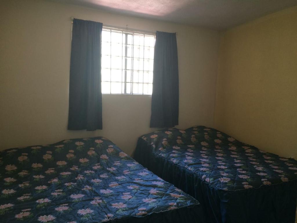 Postel nebo postele na pokoji v ubytování Blanquita Apartment