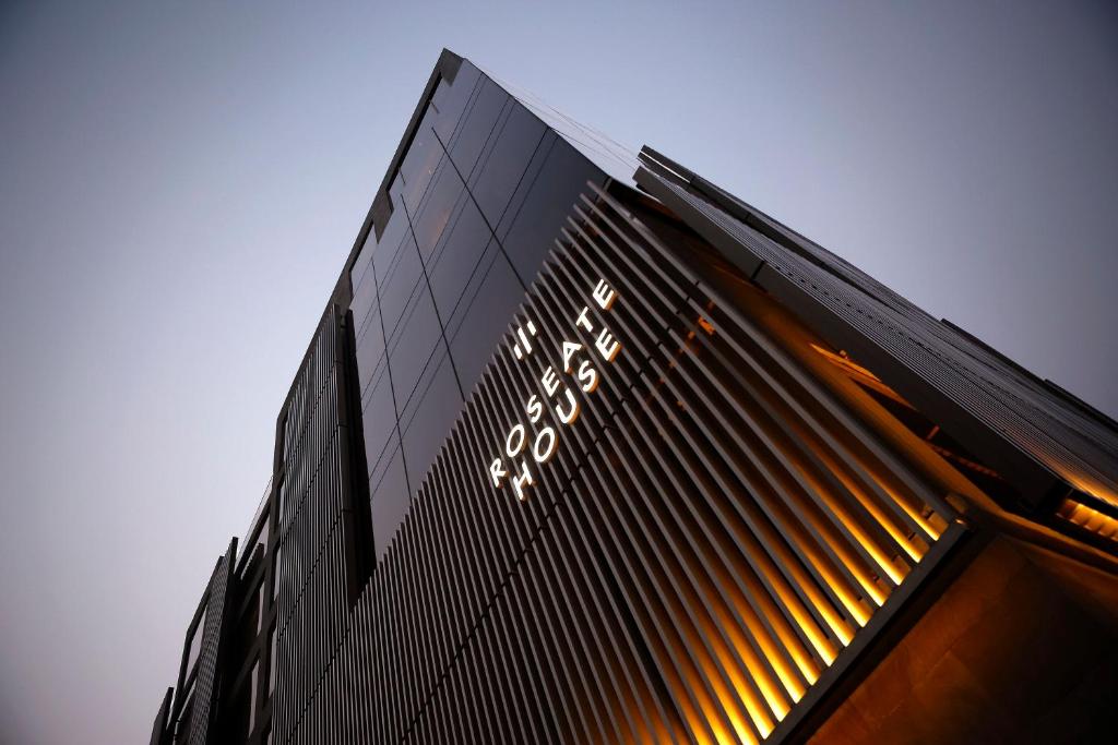 a black building with lights on the side of it at Roseate House New Delhi in New Delhi