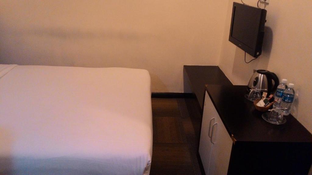 Postel nebo postele na pokoji v ubytování Prince Hotel