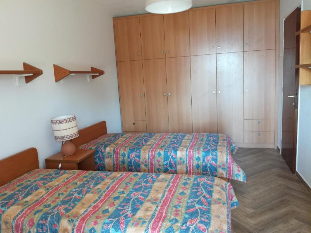 Postel nebo postele na pokoji v ubytování Villa Kalandra