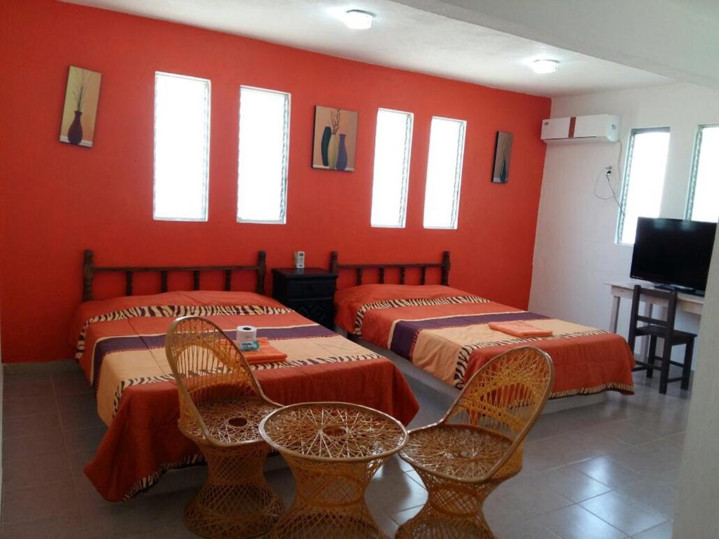 Postel nebo postele na pokoji v ubytování Hotel Playa Krystal