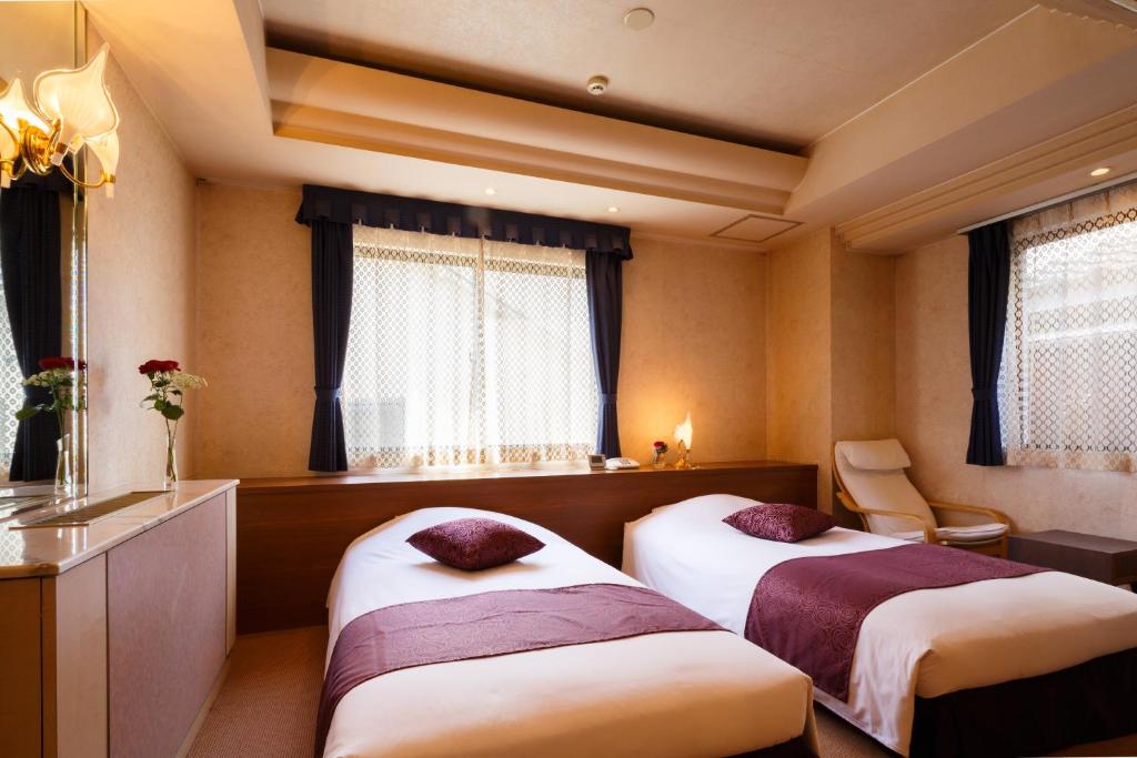 Postel nebo postele na pokoji v ubytování Hotel In Kyoto Sasarindou