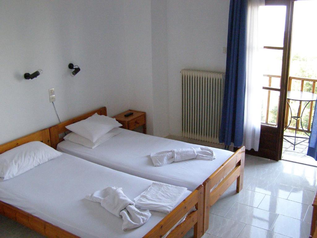 Postel nebo postele na pokoji v ubytování Hotel Tsagarada