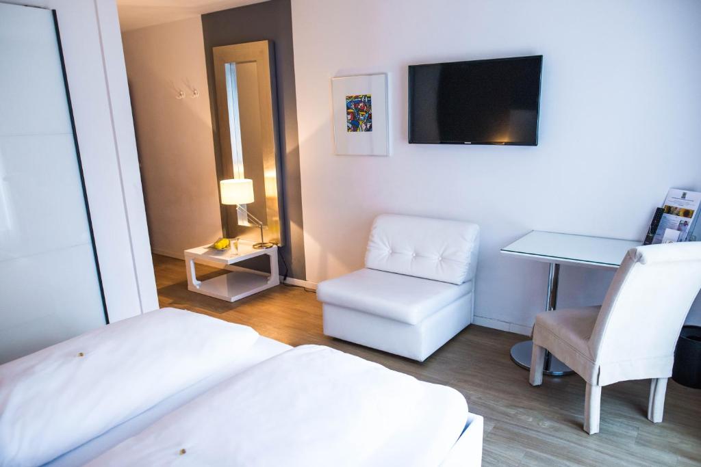 Postel nebo postele na pokoji v ubytování Hotel Domizil