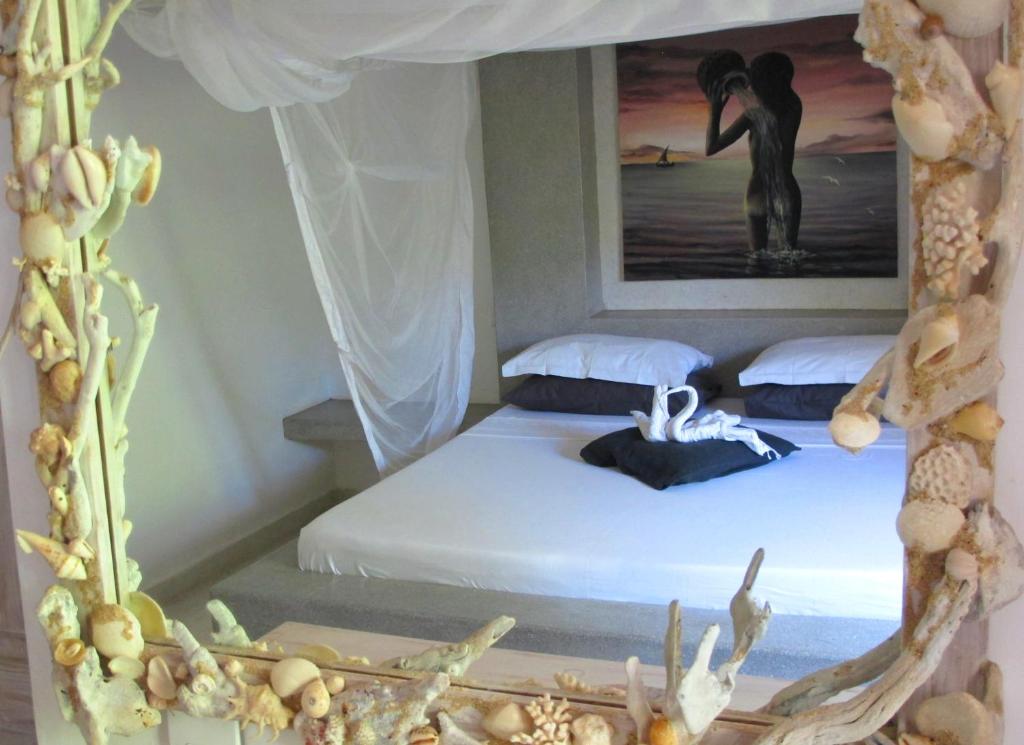 Postel nebo postele na pokoji v ubytování Baobab Village