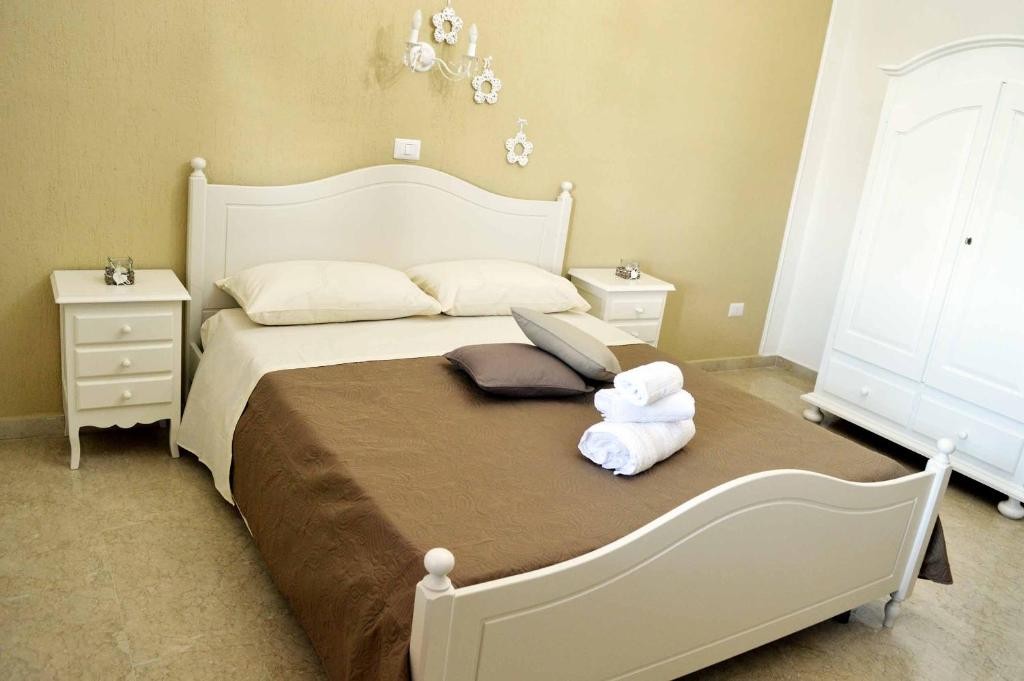 Postel nebo postele na pokoji v ubytování B&B Profumo di Alloro