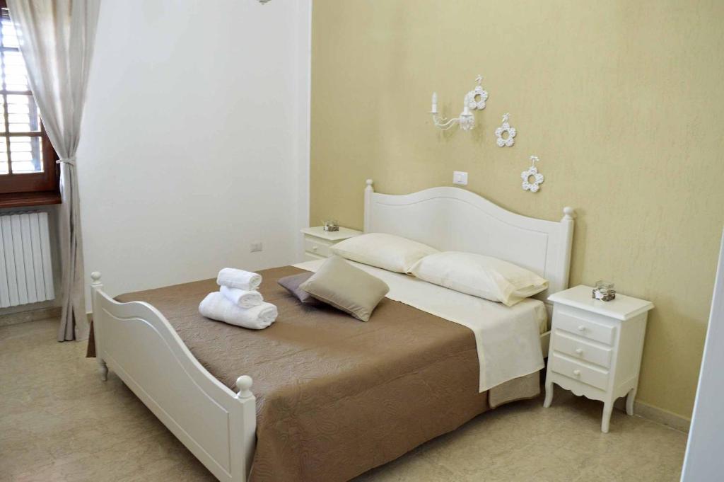 Postel nebo postele na pokoji v ubytování B&B Profumo di Alloro