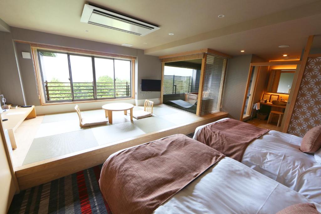 Postel nebo postele na pokoji v ubytování Hakone Yuyado Zen
