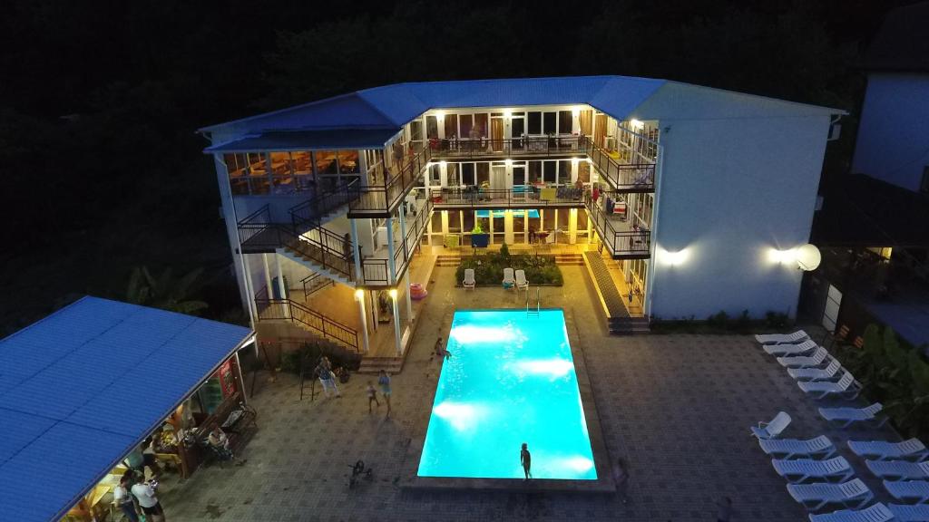 an overhead view of a building with a swimming pool at "Рояль" Гостевой дом in Loo