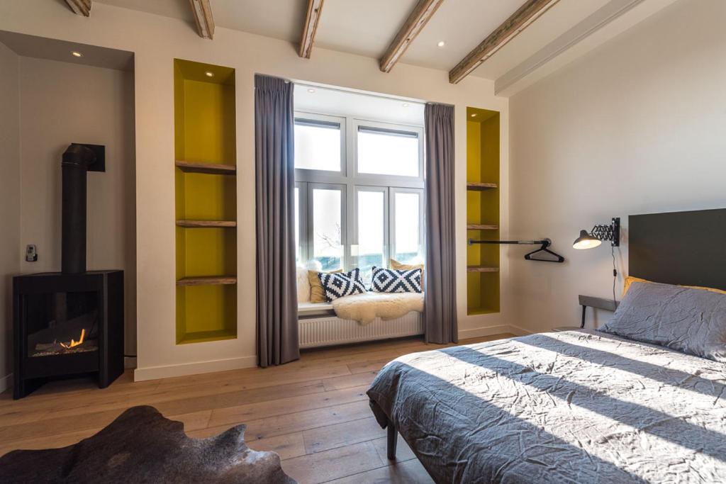 Postel nebo postele na pokoji v ubytování Loods Logement