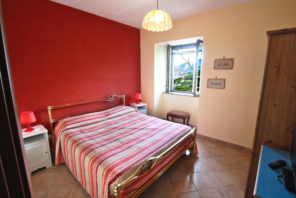 Postel nebo postele na pokoji v ubytování Casarufolo Paradise