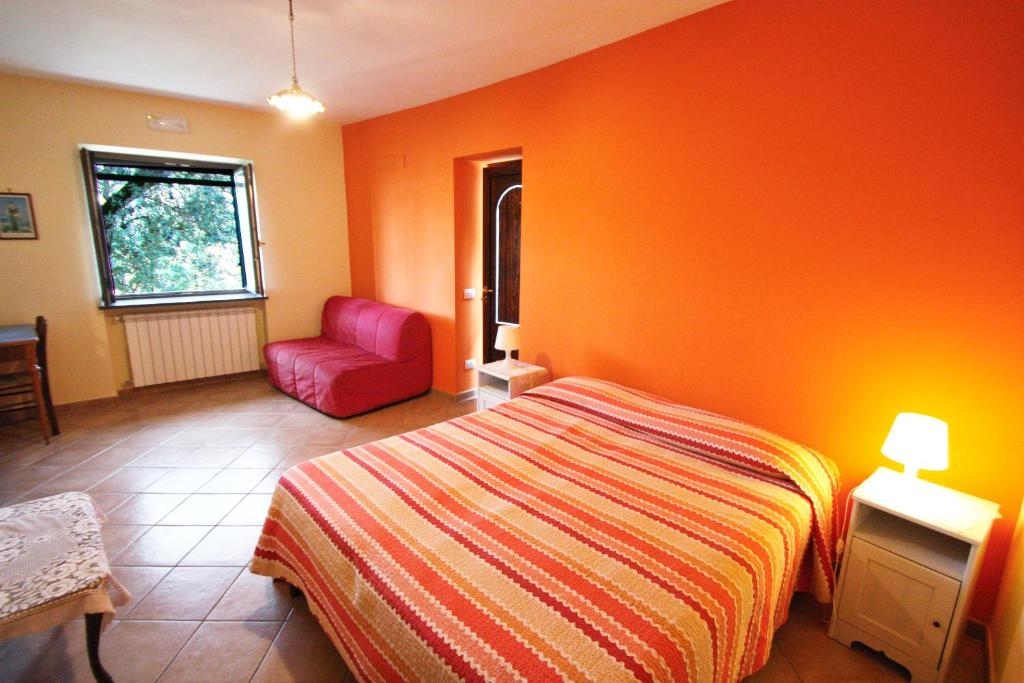 Postel nebo postele na pokoji v ubytování Casarufolo Paradise