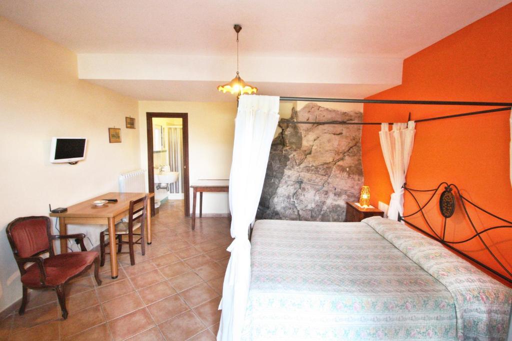 Postel nebo postele na pokoji v ubytování Casarufolo Paradise