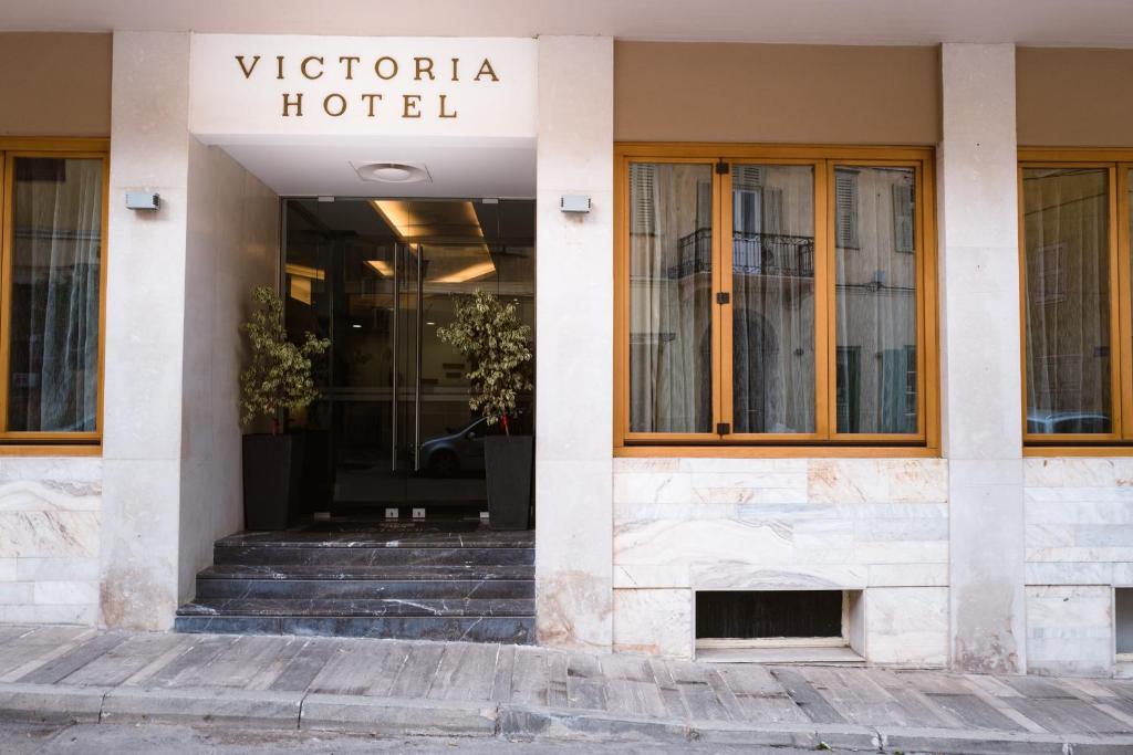 a building with a sign that reads victoria hotel at Victoria Hotel in Nafplio