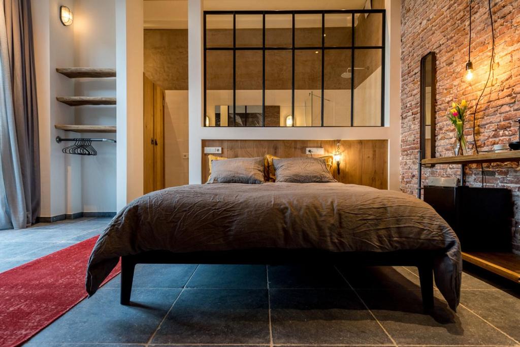 Postel nebo postele na pokoji v ubytování Loods Logement
