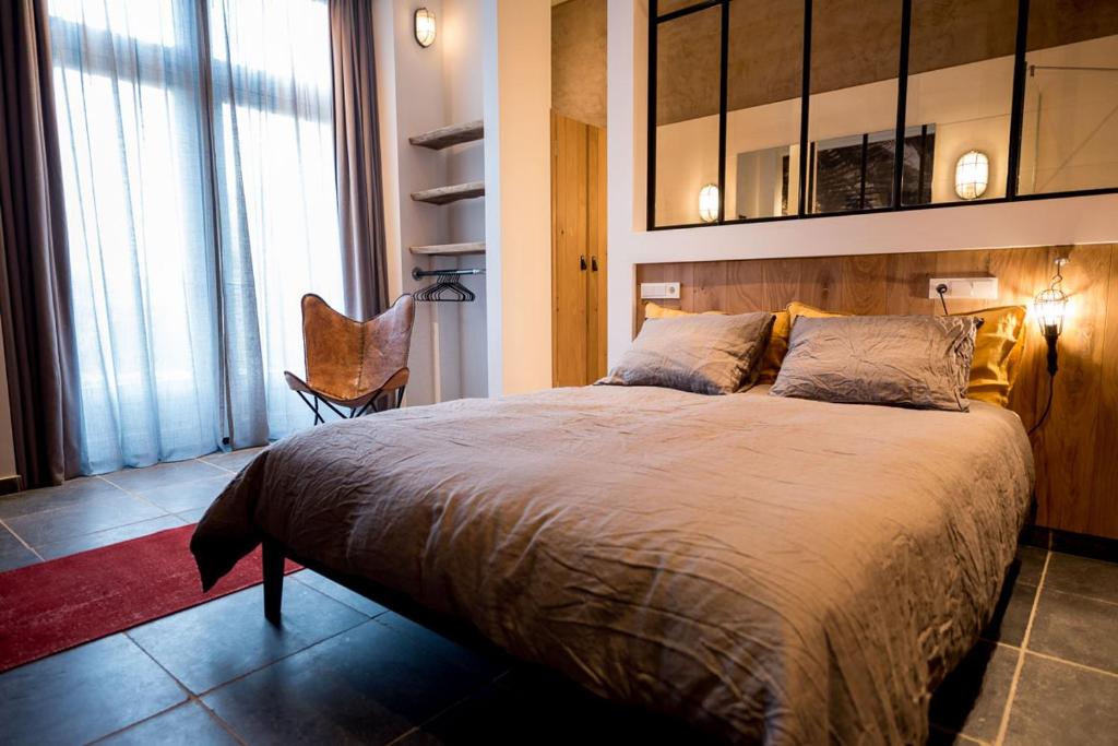 Postel nebo postele na pokoji v ubytování Loods Logement