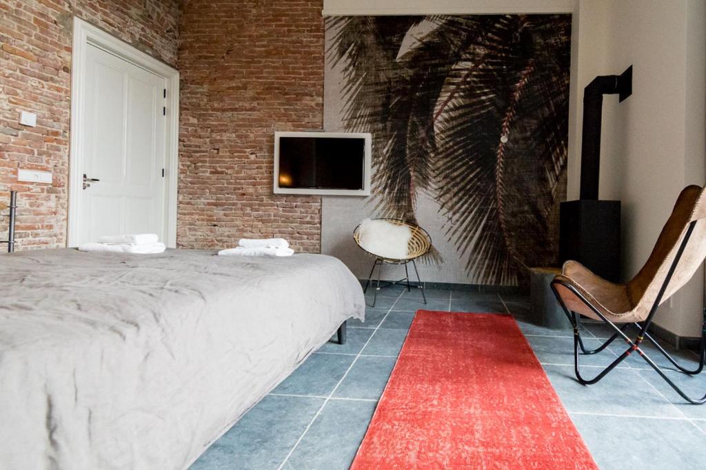 Postel nebo postele na pokoji v ubytování Loods Logement