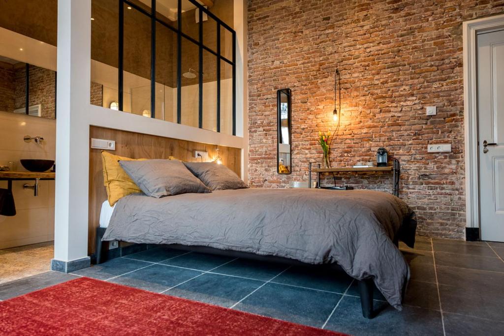 Postel nebo postele na pokoji v ubytování Loods Logement