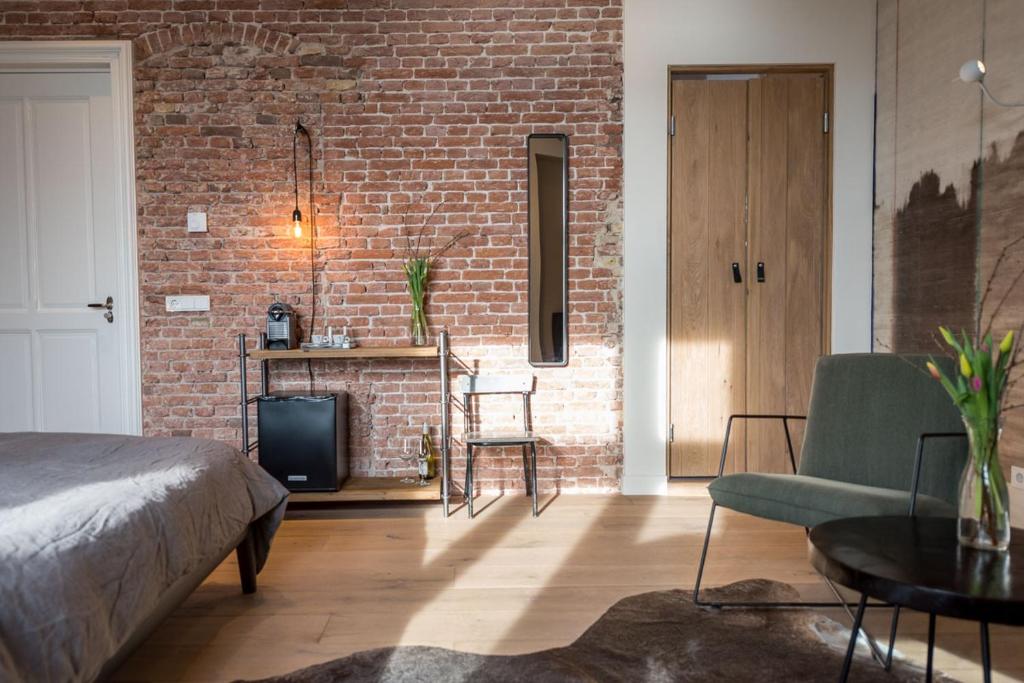 Postel nebo postele na pokoji v ubytování Loods Logement