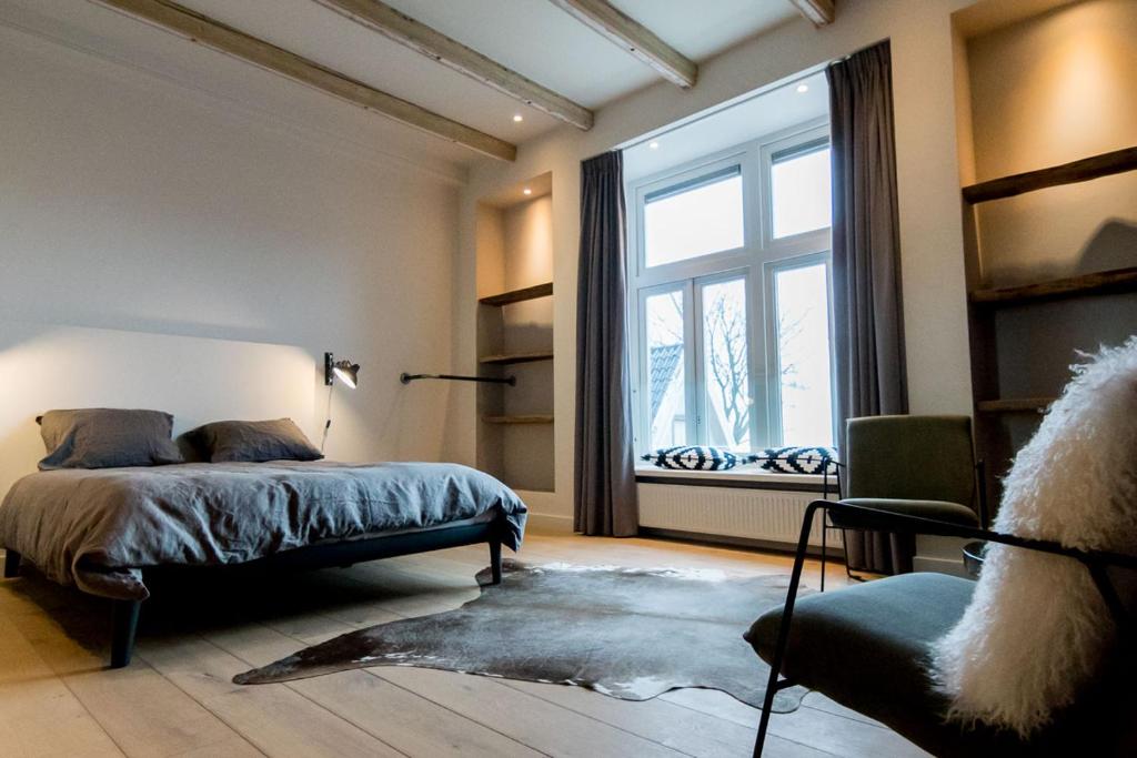 Postel nebo postele na pokoji v ubytování Loods Logement