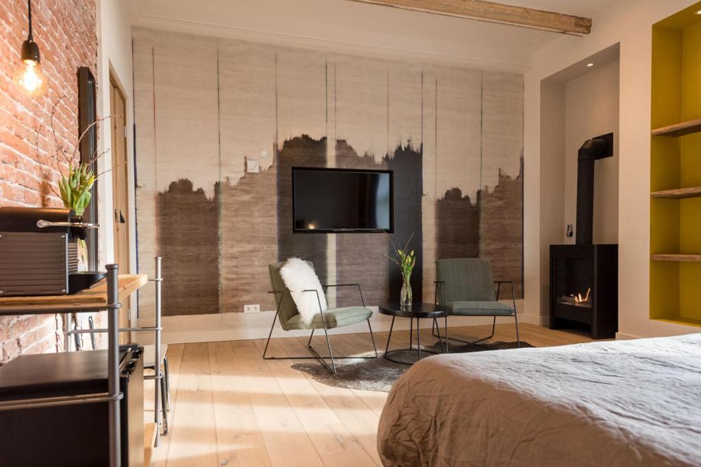 Postel nebo postele na pokoji v ubytování Loods Logement