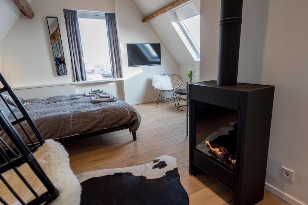Postel nebo postele na pokoji v ubytování Loods Logement