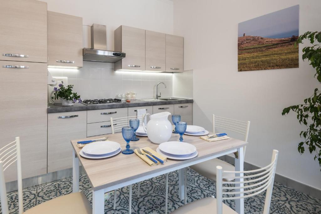 Kuchyň nebo kuchyňský kout v ubytování Suite della villa