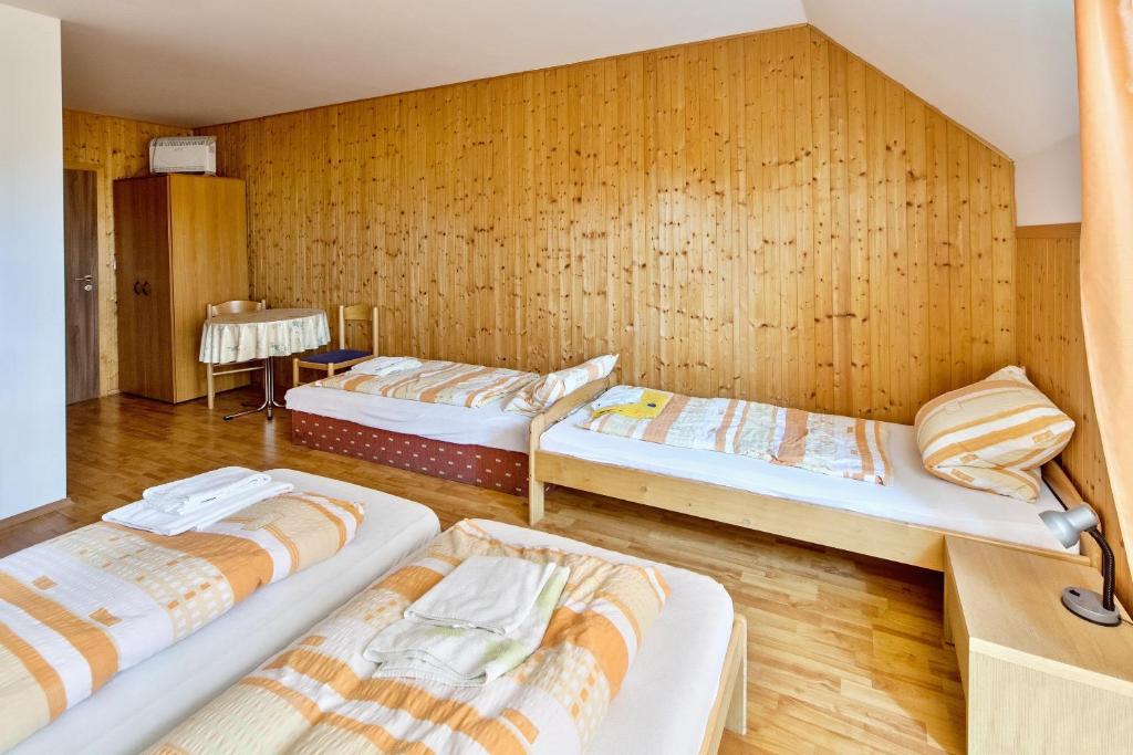 Postel nebo postele na pokoji v ubytování Penzion Šalamoun