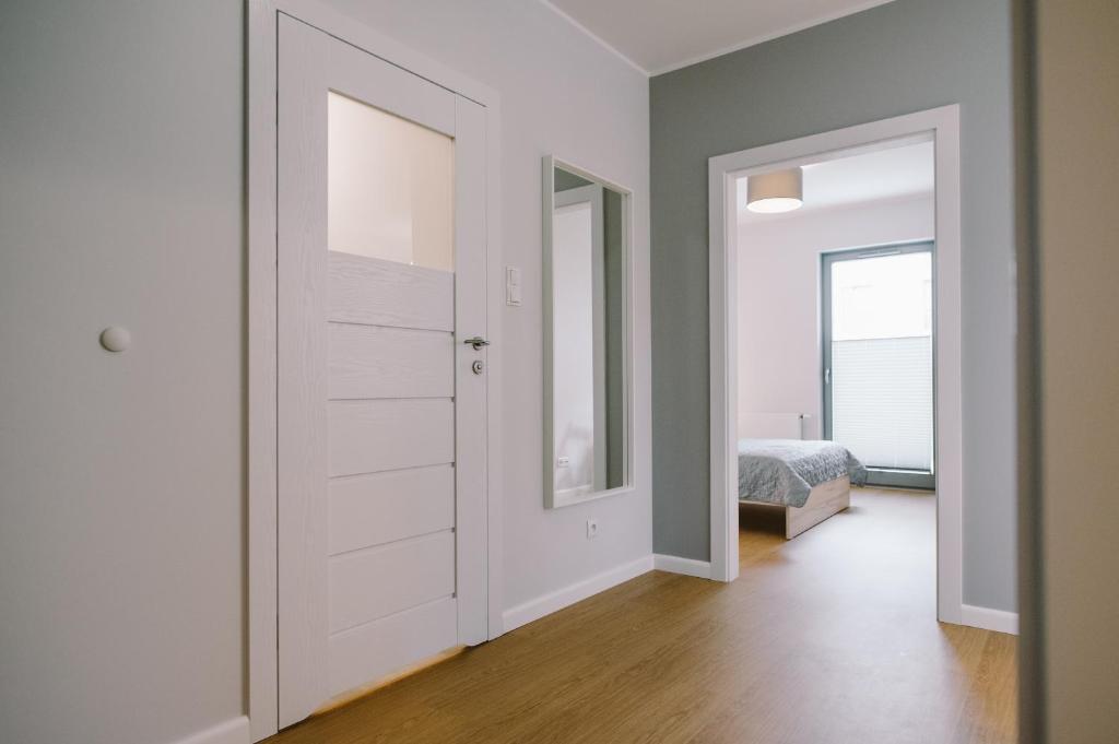 Posteľ alebo postele v izbe v ubytovaní Apartamenty Rodzina nad morzem