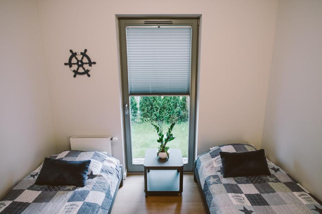Posteľ alebo postele v izbe v ubytovaní Apartamenty Rodzina nad morzem