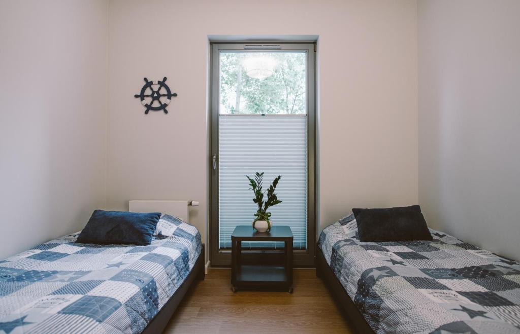 Posteľ alebo postele v izbe v ubytovaní Apartamenty Rodzina nad morzem