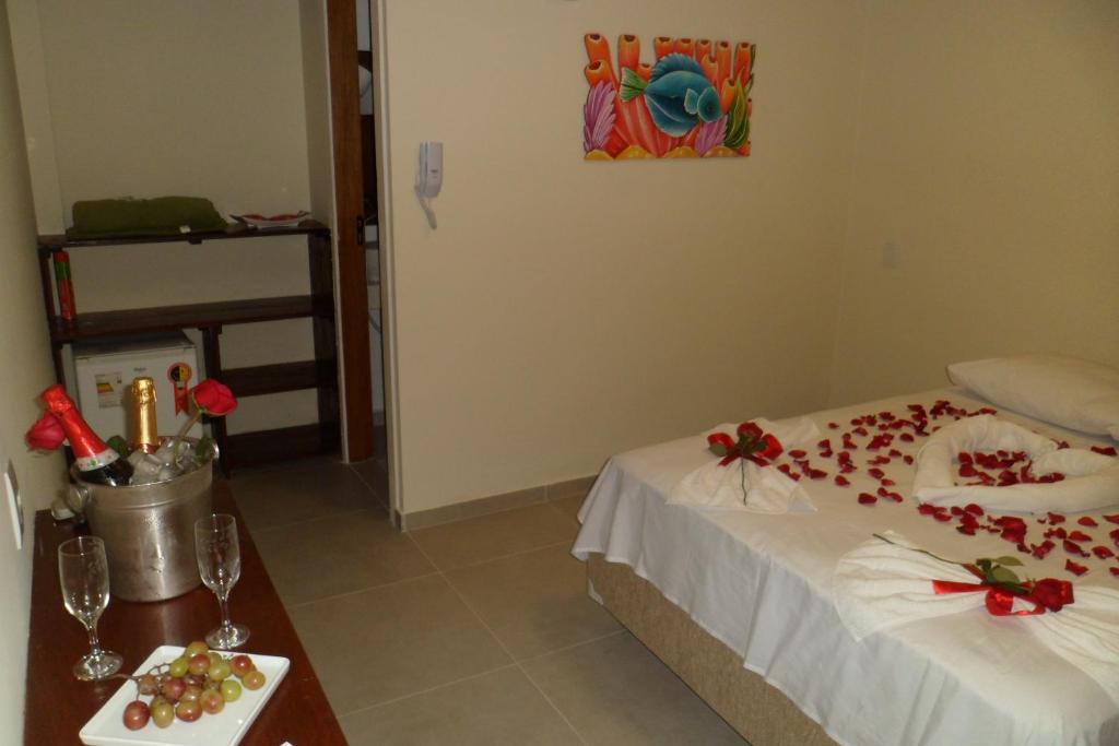 Postel nebo postele na pokoji v ubytování Hotel Pousada Rio Mar