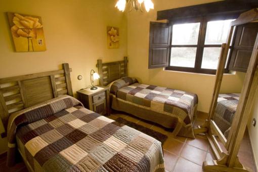 Postel nebo postele na pokoji v ubytování Casas Herrenales de Ulaca