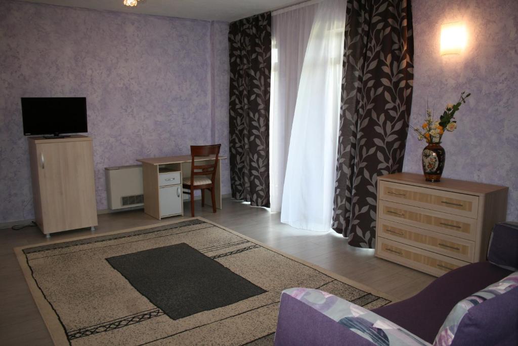 TV a/nebo společenská místnost v ubytování Hotel Hyperion