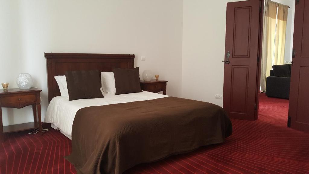Postel nebo postele na pokoji v ubytování Solar Do Conde Garden Hotel