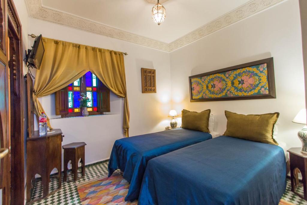 Postel nebo postele na pokoji v ubytování Dar Fes Medina Ziat