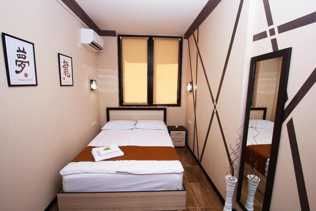 Postel nebo postele na pokoji v ubytování WOW Guest house in apartment 141