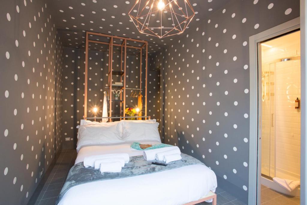 Postel nebo postele na pokoji v ubytování Intervallo Boutique Hotel