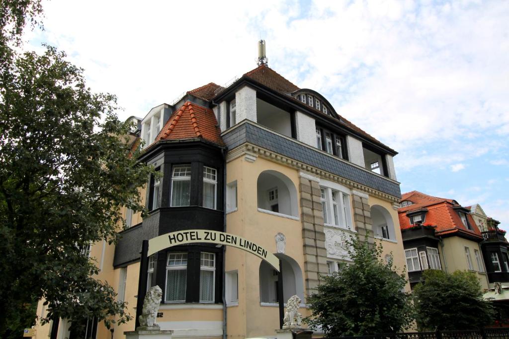 a building with a sign on the front of it at Hotel Zu den Linden in Dresden