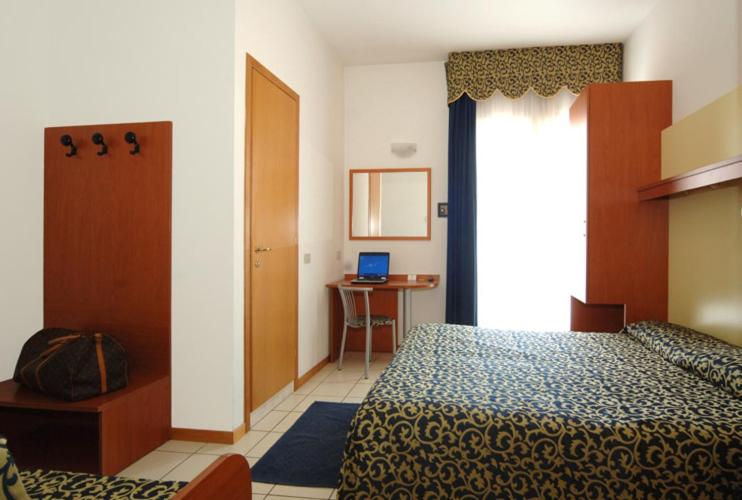 Posteľ alebo postele v izbe v ubytovaní Hotel Lido