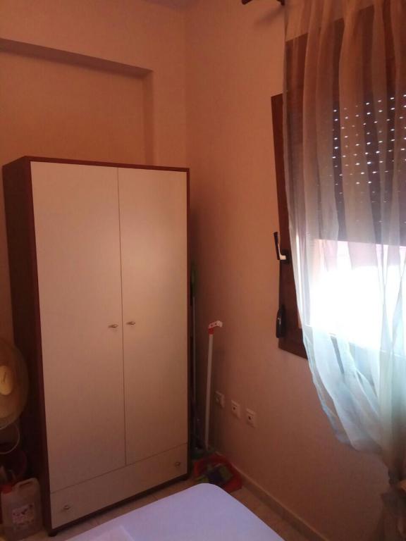 Postel nebo postele na pokoji v ubytování Joanna Apartment