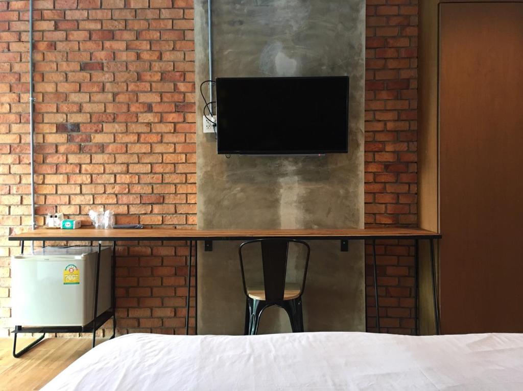 TV a/nebo společenská místnost v ubytování De Nan Hotel