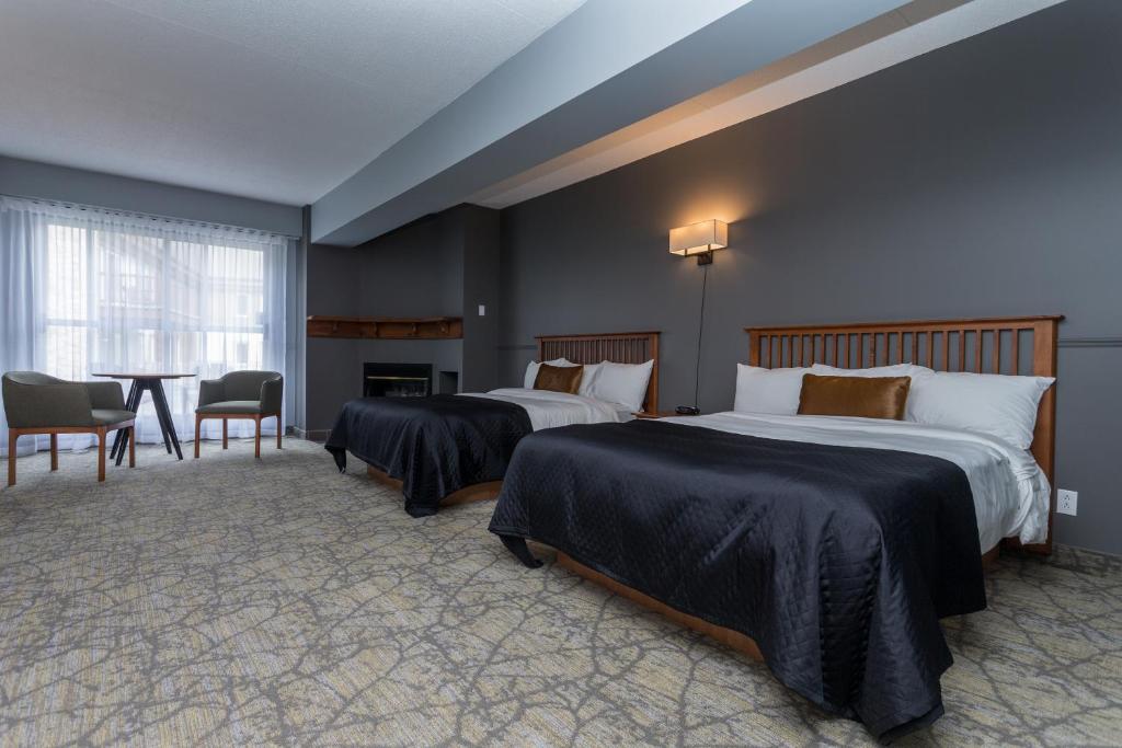 Postel nebo postele na pokoji v ubytování Le Grand Lodge Mont Tremblant